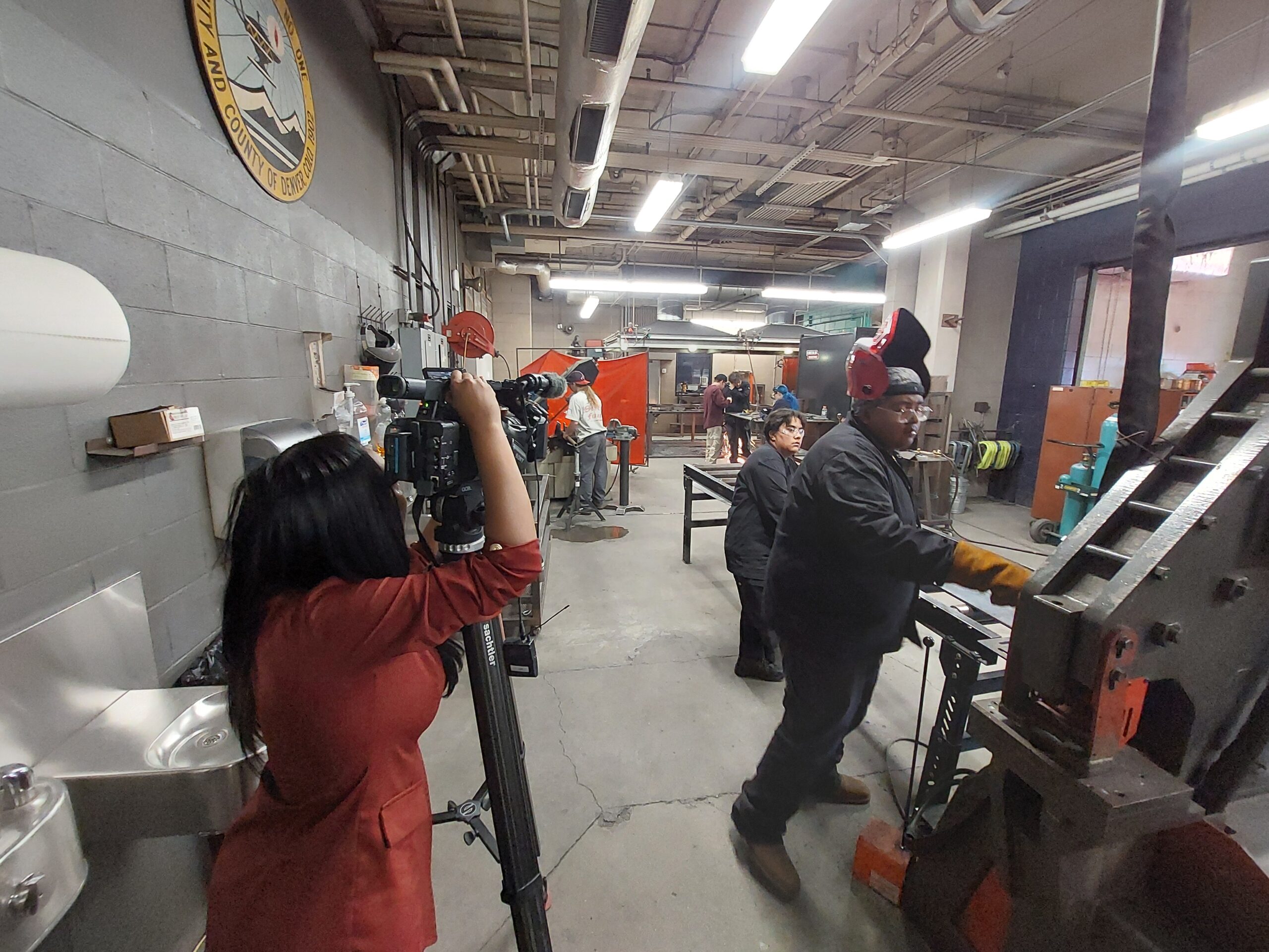 Fox31 Reporter recording Welding students in Welding lab at Branch Campus
